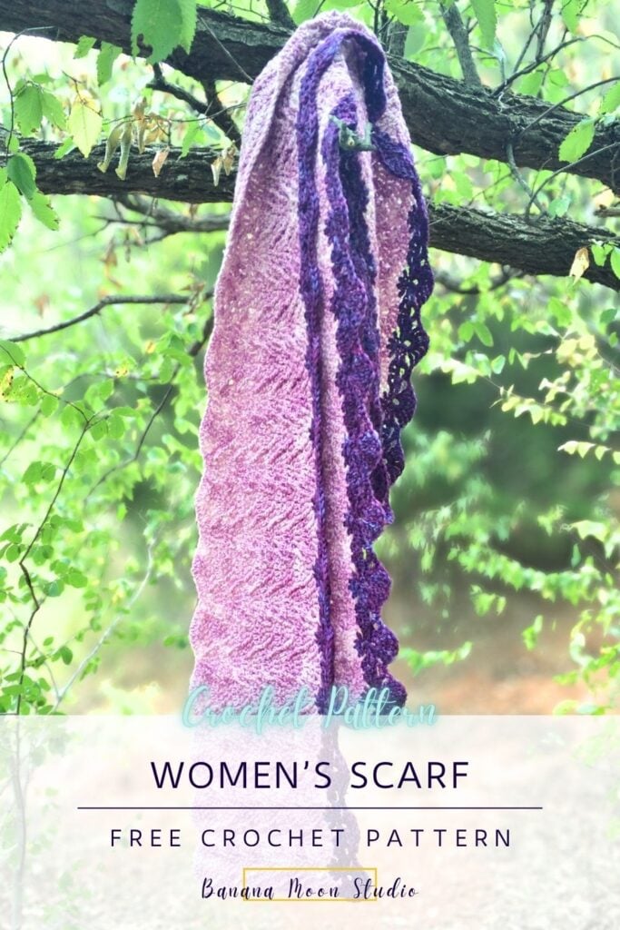 A purple, textured crochet scarf hanging over a tree branch. A panel with text reads: Women's scarf free crochet pattern, Banana Moon Studio.