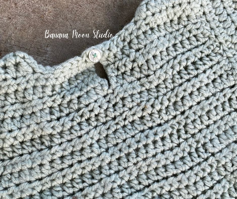 Close up of the back neckline of a crochet top for a children's costume pattern. Text on the image reads: Banana Moon Studio.