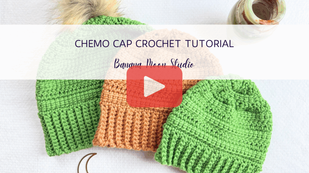 Three crochet hats laying flat together on a white surface. A banner with text reads: Chemo cap crochet tutorial, banana moon studio. A red and white play button is centered over the image.