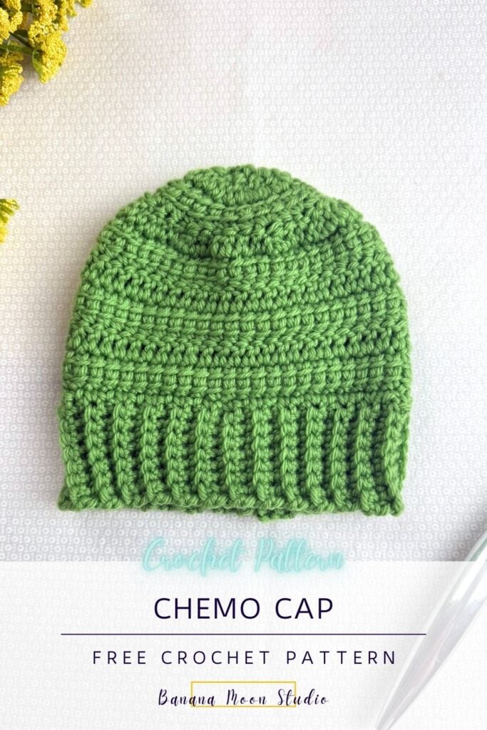 A lime green crochet beanie lying on a white surface with a crochet hook and yellow flowers. A banner with text reads: Chemo cap free crochet pattern, banana moon studio.