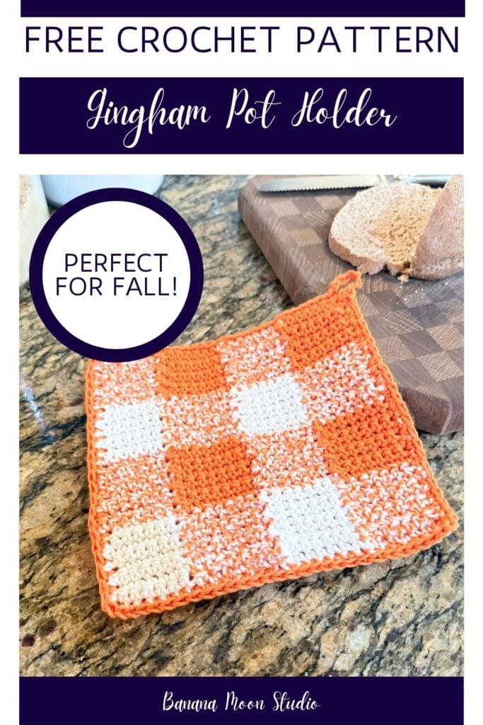 Orange and white gingham crochet pot holder lying on a granite countertop next to a loaf of bread on a cutting board. Panels with text read: Free crochet pattern, gingham pot holder, perfect for fall, banana moon studio.