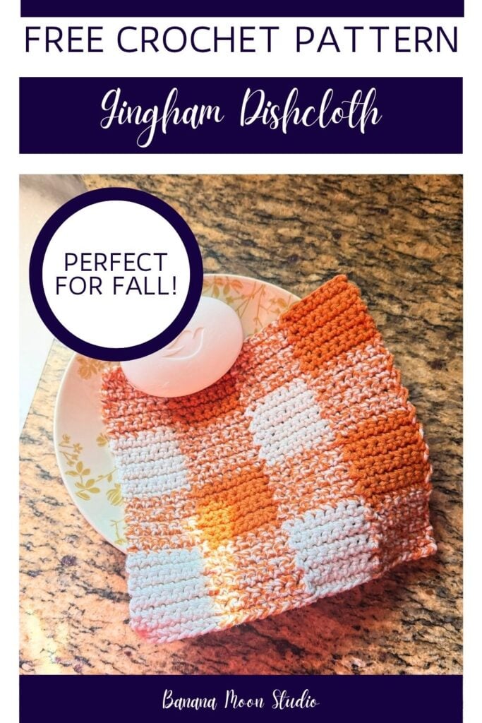 Orange and white gingham crochet dishcloth and a bar of soap lying in a bowl on a granite countertop. Panels with text read: Free crochet pattern, gingham dishcloth, perfect for fall, banana moon studio.